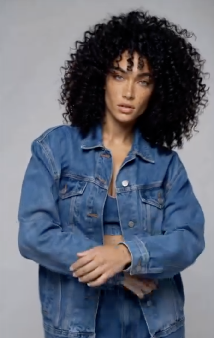 Layla Rey portrait in a denim jacket, soft studio light